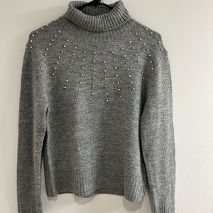 Grey turtleneck sweater with rhinestones